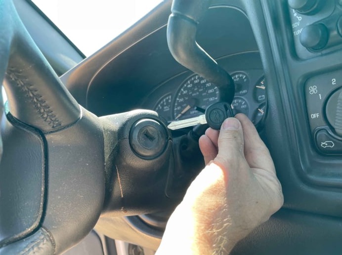 locksmith repairing car ignition and cutting motorcycle key in Nevada